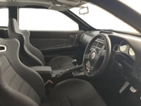 Nissan Skyline GT-R R34 White Pearl V-spec II 1:18...