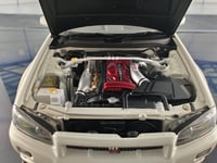 Nissan Skyline GT-R R34 White Pearl V-spec II 1:18...