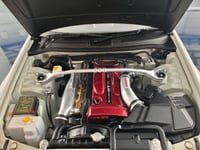 Nissan Skyline GT-R R34 White Pearl V-spec II 1:18...