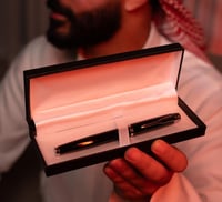 قـلم سيـفين ونخلة