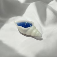 شمعة الصدفه مزينه بقلتر