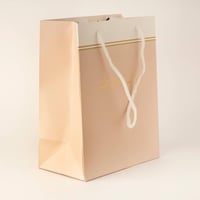 أكياس فاخرة للعيد لون وردي وختم "عيدكم مبارك /العد...