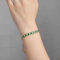 اسورة نسائية رقيقة بكرستالات خضراء مطلية ذهب عيار...