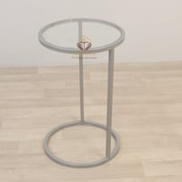 طاولة خدمة قاعدة لون فضي سطح زجاج شفاف