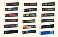 ميدالية مفاتيح قماش أي سيارة