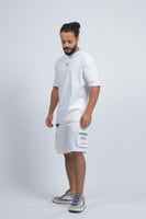 تيشرت اوفر سايز ابيض عباره خضراء