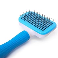 مشط حديد للقطط والكلاب مع مكبس لإزالة الشعر لون از...