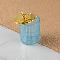 علبة زجاج بغطاء ذهبي