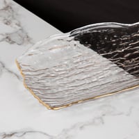 صحن تقديم زجاج بأطراف ذهبية