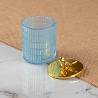 علبة زجاج بغطاء ذهبي