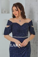 فستان سهرة مرصع بالفصوص اللماعة