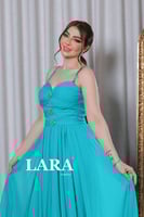 فستان شيفون طويل مزين بكرستالات على الصدر