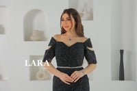 فستان سهرة مرصع بالفصوص اللماعة