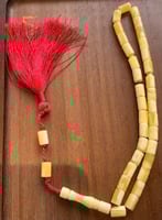 سبحة ترب كهرمان بيروتي إسطوانية شرابة حمراء