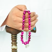 سبحة عين النمر الوردي 33 حبة 10 مم