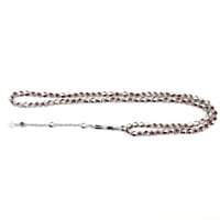 سبحة عظم وياقوت مطعّمة بالفضة — تقسيم 33×3، خرز 6...