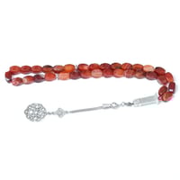 سبحة عقيق كبدي بلمساتها الدقيقة