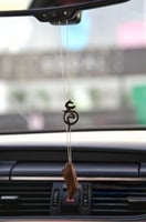 تعليقة بحرفين متداخلة بكِسرة العود