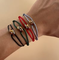 اساورة خيط كارتير