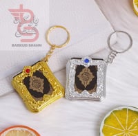 ميدلية مصحف صغير ورقي الون ذهبي فضي اخضر اصفر