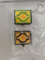 ميدلية مصحف صغير ورقي الون ذهبي فضي اخضر اصفر