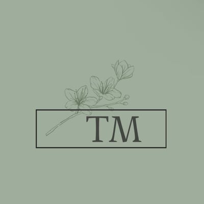 T.M logo
