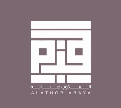 العذوب عباية logo