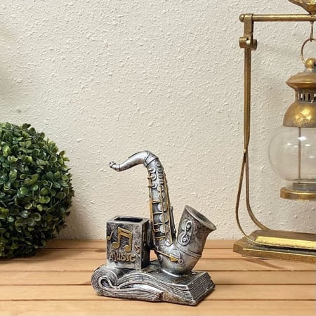 ساكسفون بكتاب مقلمية تحف وهدايا ديكورات سيراميك ساكسفون نوتة موسيقيه