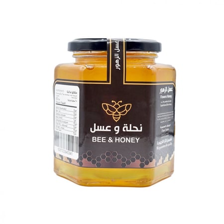 عسل الزهور الطبيعي بلون ذهبي فاتح نقي