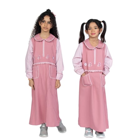 مريول إبتدائي زهري بتصميم كويتي من ذو الجناحين