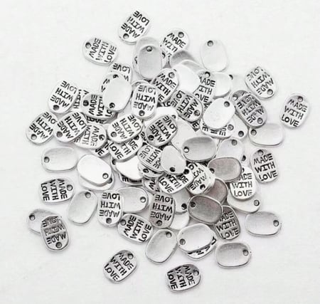 لوجو معدني بـ3 اشكال عشوائية 12 حبة