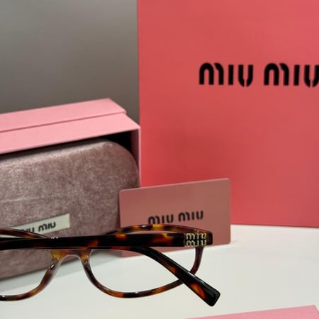 نظارة ميو ميو Line باللون التايقر وعدسة شفافة