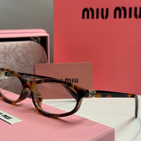 نظارة ميو ميو Line باللون التايقر وعدسة شفافة