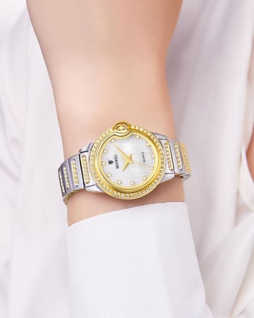 ساعة يد نسائية لون ذهبي فضي مزينة بالزركون