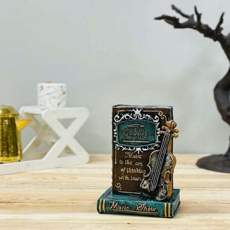 جيتار مع كتاب سيراميك انتيك وحصالة تحف وهدايا ديكور المنزل ديكور مكتبي