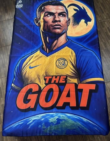 علم رونالدو “THE GOAT”