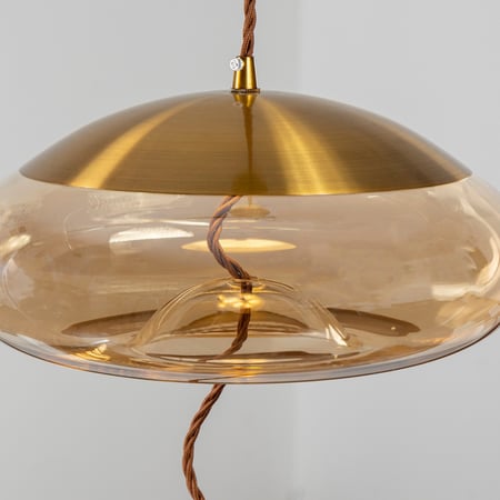 إضاءة معلقة بيضاوي زجاج عسلي