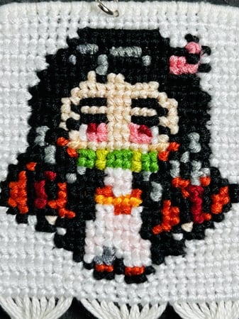 ميدالية  نيزوكو من انمي قاتل الشياطين