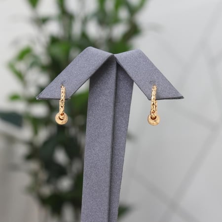 حلق كرات الذهب