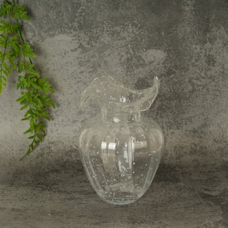 فازة زجاج بتصميم عصري علي شكل زهرة لون شفاف مقاس 14x23 سم