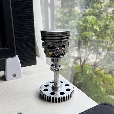 تمثال منحوت على شكل وجه جمجمة ومكبس مصنوع يدويا