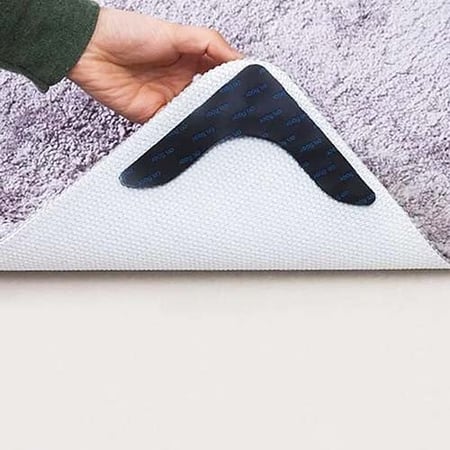 مثبت السجاد على السيراميك والباركية بواسطة لاصق بمنع الانزلاق