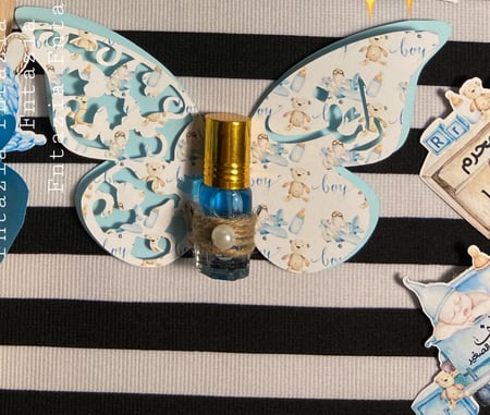 توزيعات فراشه مع توله مسك البودره