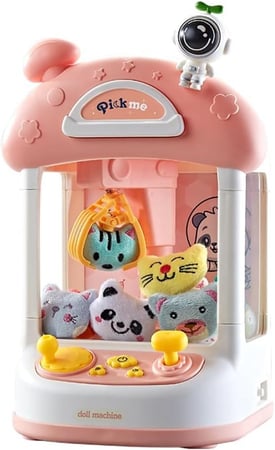 آلة الدمية رائد الفضاء أو آلة توزيع الألعاب باللون الوردي