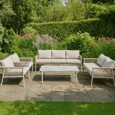 طقم جلسة خارجية 7 اشخاص بلون رمادي فاتح بتصميم حبال عصري وهيكل معدني متين مع وسائد مريحة وطاولة وسط بسطح رخامي أنيق، مثالي لإضافة لمسة راقية لشرفتك أو حديقتك.