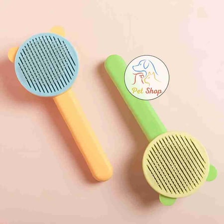 مشط شعر للقطط والكلاب شكل دائري مع اذن ضغاط قابل لازالة الشعر