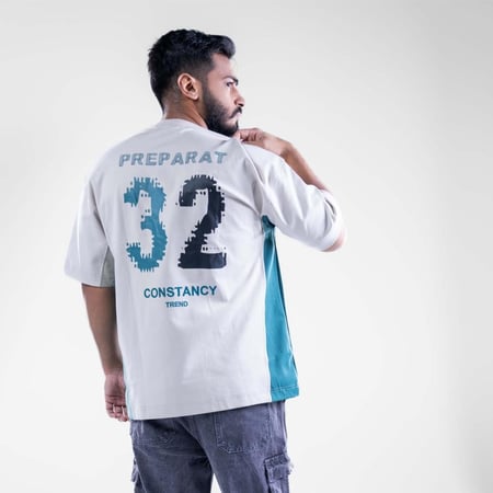 تيشيرت اوفر سايز نص كم بكتابة اماميه وخطوط منحنيه - بيج