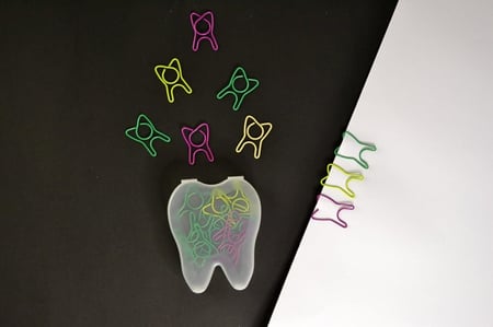 مشابك ورق شكل الاسنان