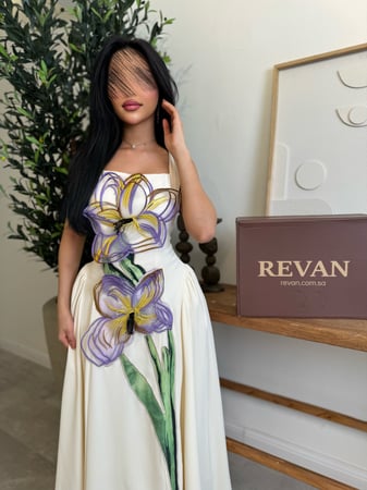 فستان عيد بتطريز ورد بارز أناقة فنية راقية من ريڤــان