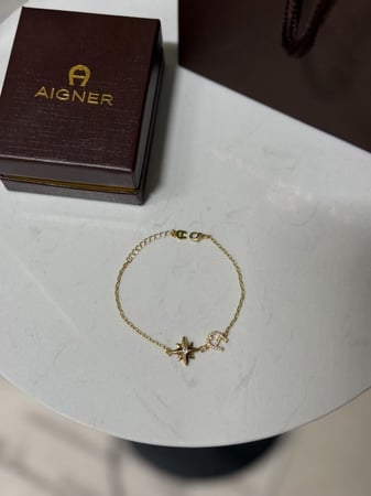 إسوارة AIGNER ذهبي